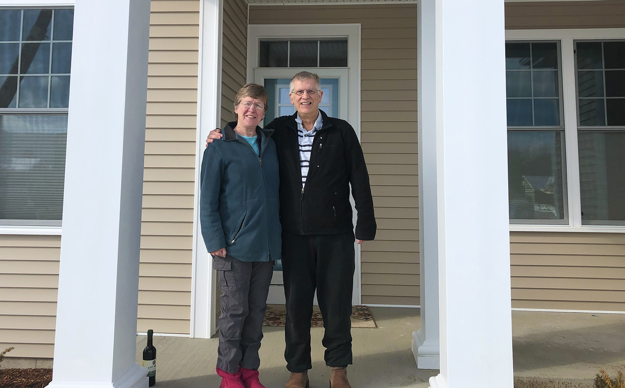 man and woman standing in front of a home that was sold by ben durant